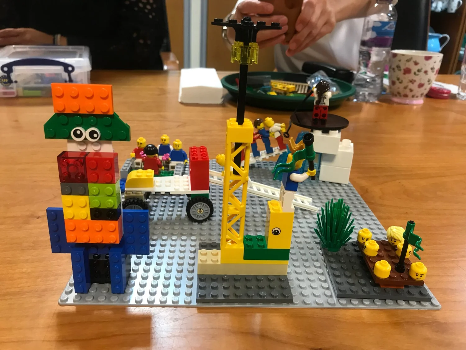A LEGO® model of figures around a bridge