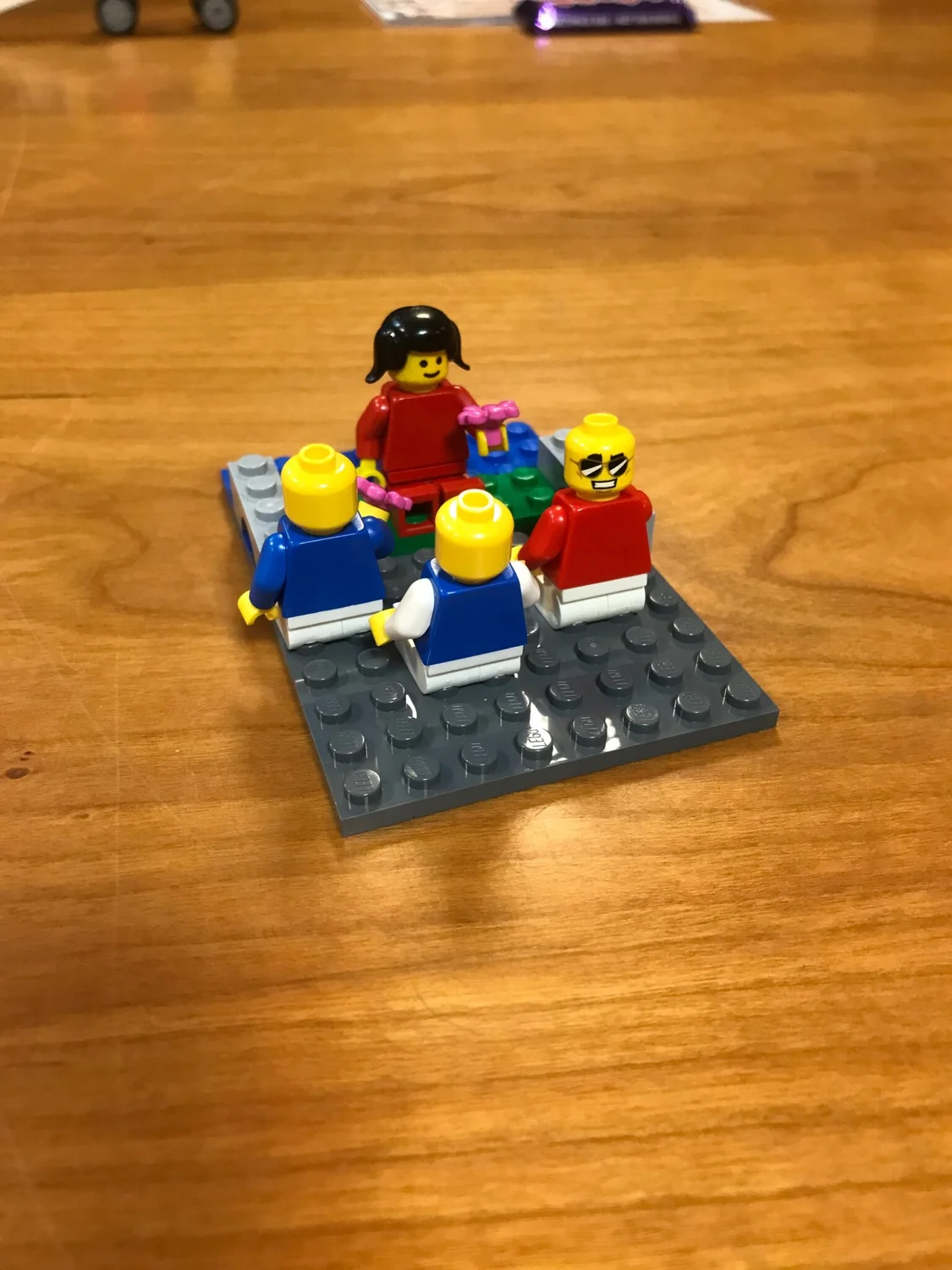 LEGO® models and labelled cards laid out on a baseplate