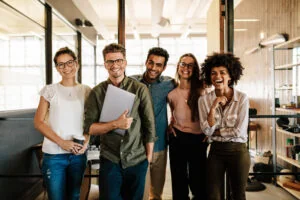 A team of professionals laughing together at work